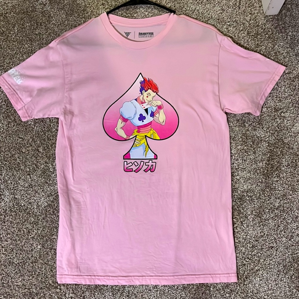A small baggy T shirt with an Hisoka decal on the front and logos on the back